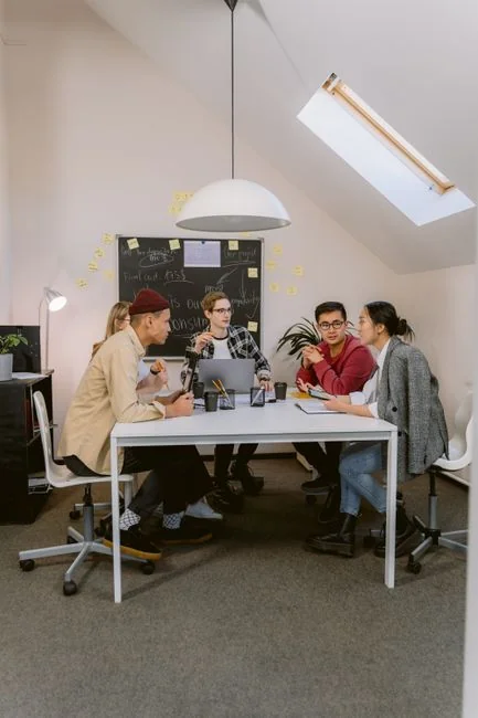 Crop anonymous male teacher writing on whiteboard with marker during social media training courses